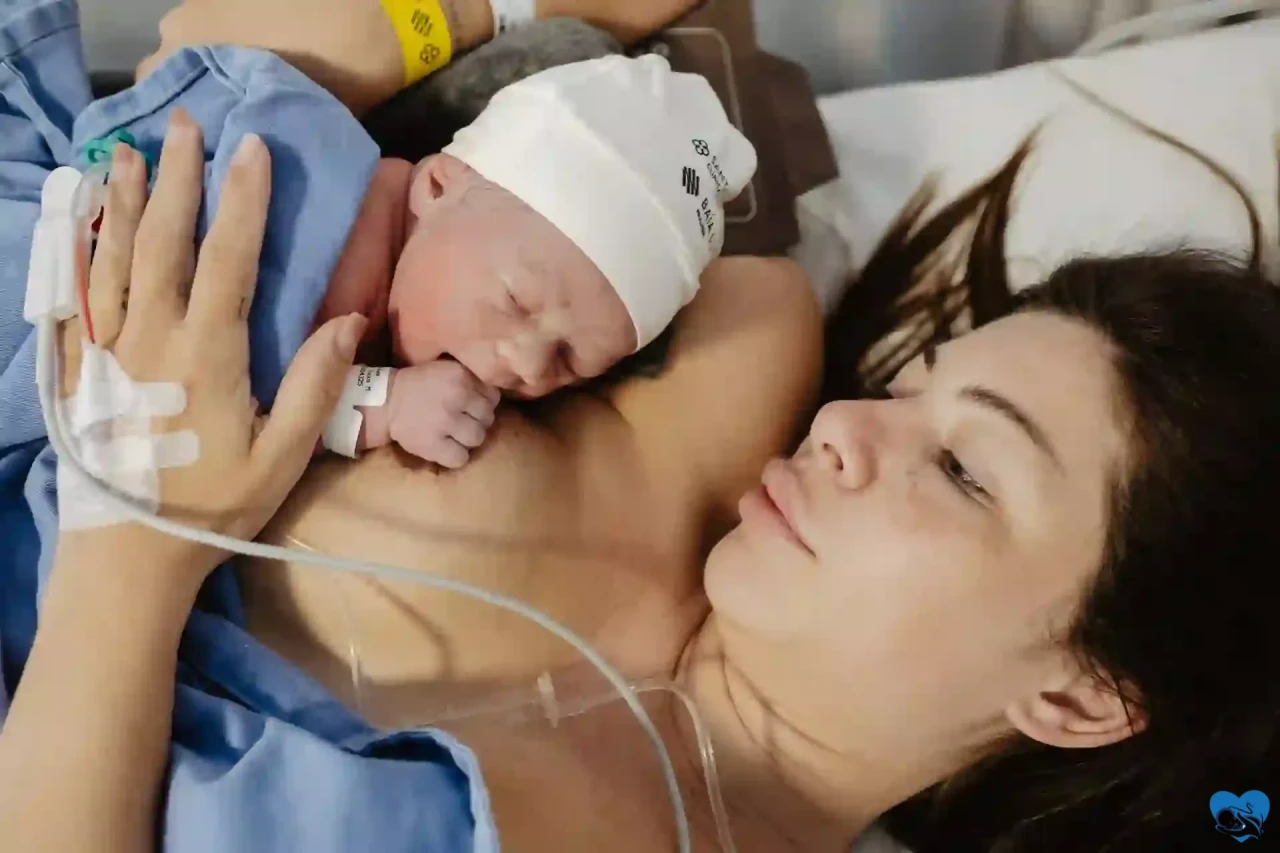 Skin-to-skin with newborn after birth in Brazil in a private maternity room (faces blurred)