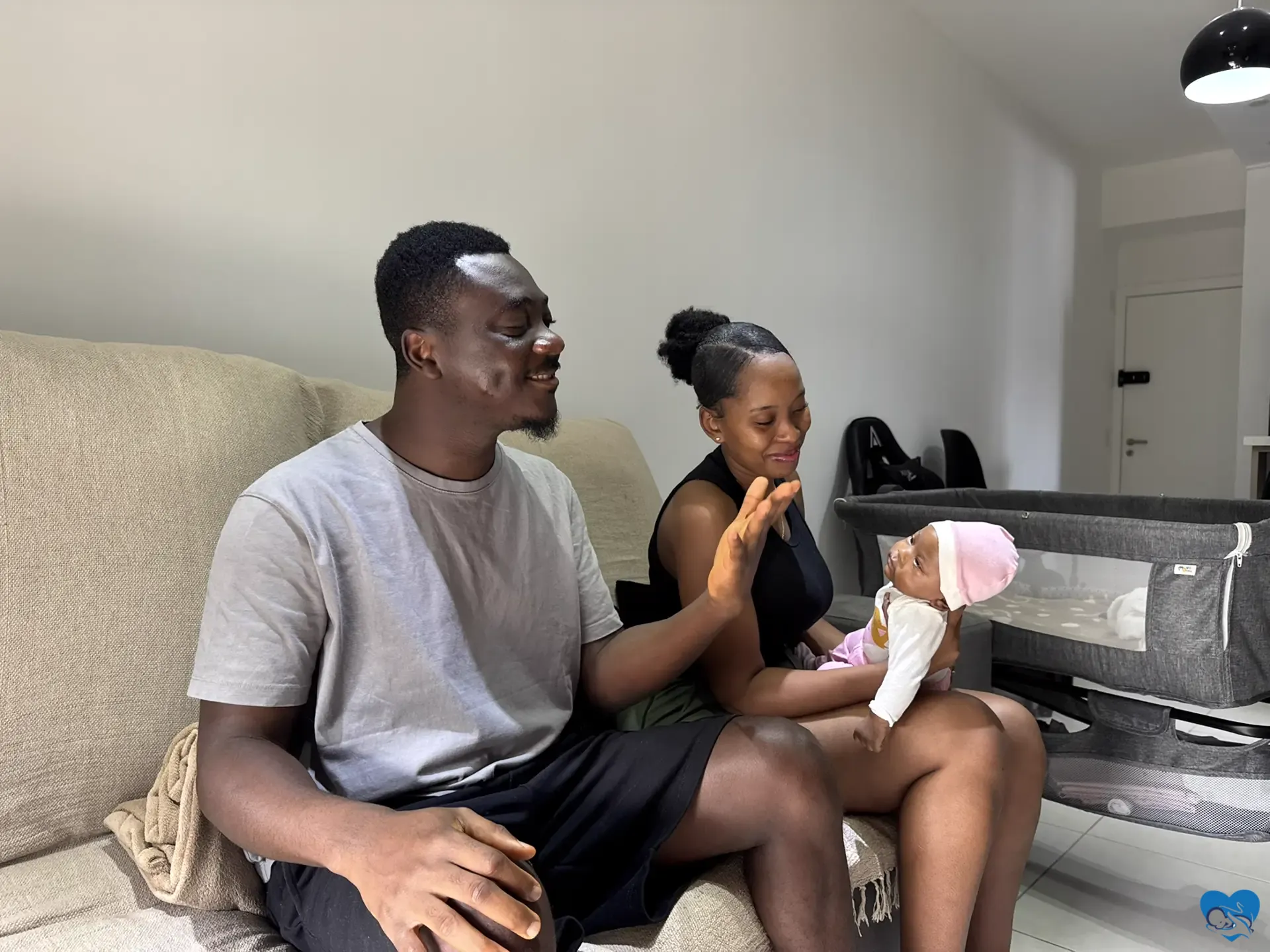 Parents caring for their newborn after birth in Brazil with family support